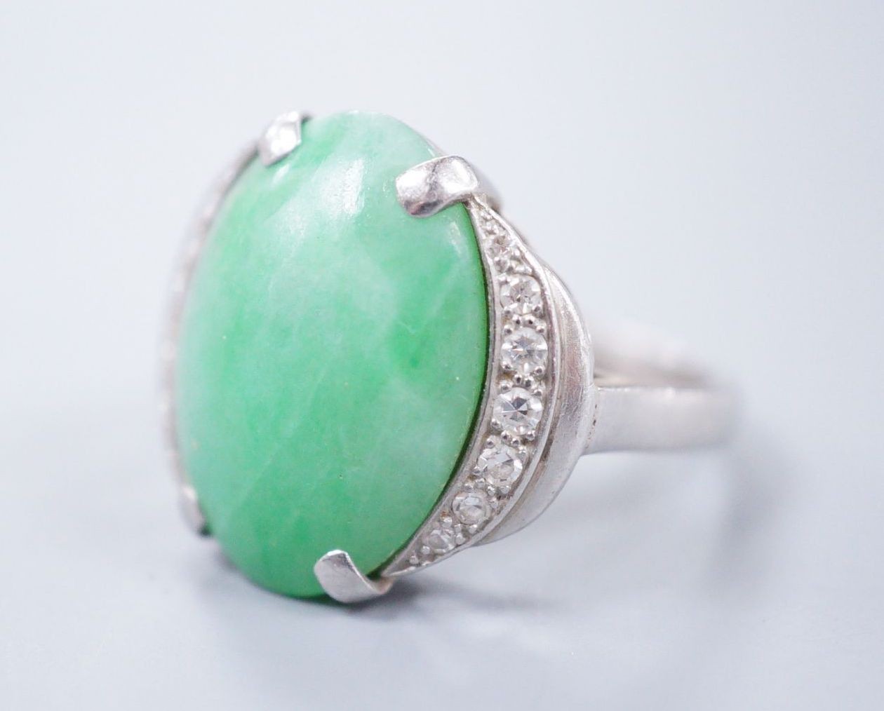 A diamond and jade set white metal dress ring, size K